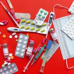 Medical supplies and medications displayed on a red background, emphasizing healthcare essentials. — THCA Bloom: Navigating t